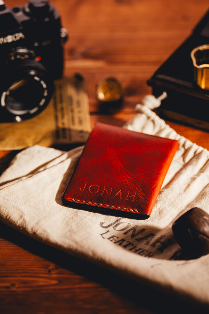 Brown leather card holder with vintage items around 