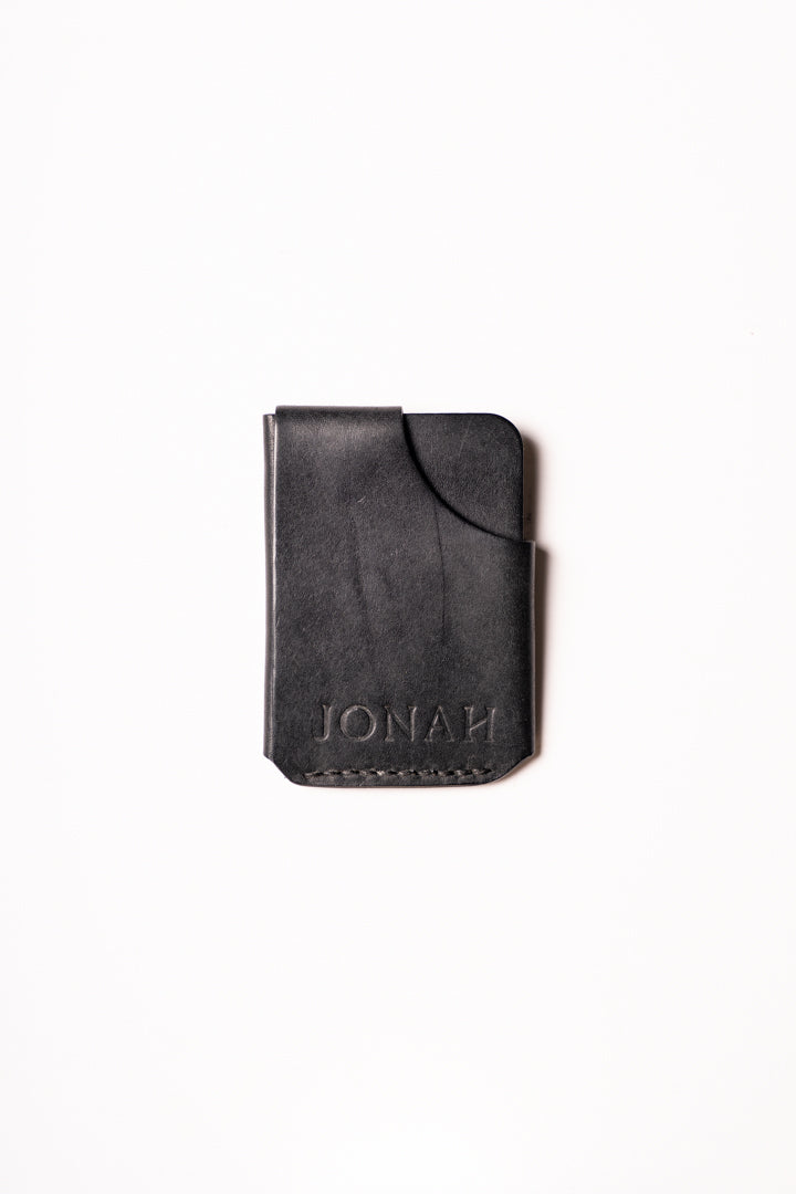 Black leather wallet with 'IONAH' branding on a white background